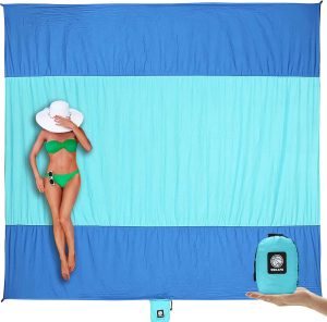 everyone needs a good beach blanket. this one is one of the best amazon beach must haves!