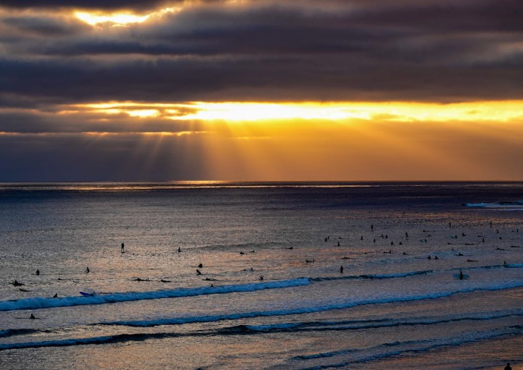 people swimming at south padre island, texas beach - one of the best us beaches in july