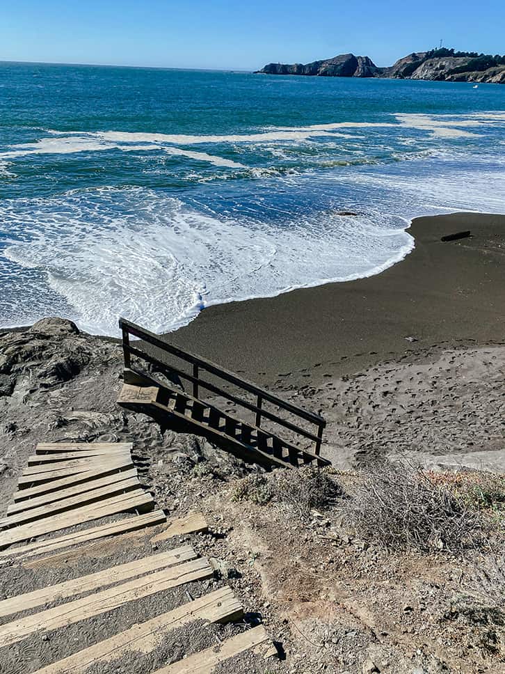 staircase down to the black sands beach