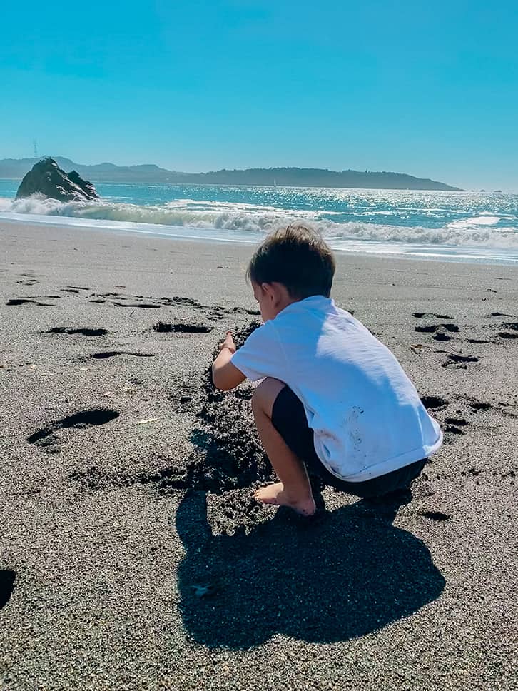 playing at black sands beach