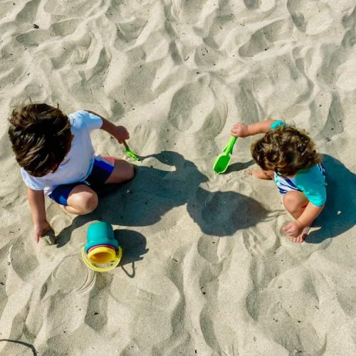 one of my best beach hacks for toddlers is to not pack too much stuff.